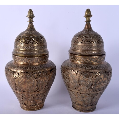 A PAIR OF 19TH CENTURY PERSIAN QAJAR BRASS VASES AND COVERS ...