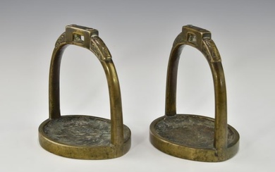 A PAIR OF CHINESE QING DYNASTY BRONZE STIRRUPS