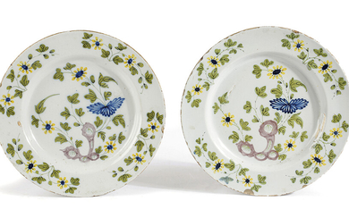 A PAIR OF DELFTWARE POTTERY CHARGERS