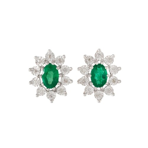 A PAIR OF DIAMOND AND EMERALD OVAL CLUSTER EARRINGS, mounted...