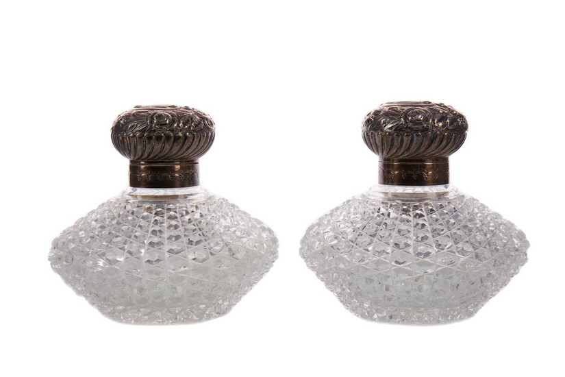 A PAIR OF VICTORIAN SILVER MOUNTED CUT GLASS SCENT BOTTLES