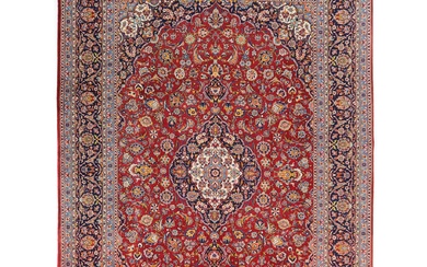 A Persian Royal Kashan Rug (390x260 cm). A classic traditional Persian rug.Intricately hand knotted using lambswool in the city of Kashan in central Persia. Having an elongated Shah Abbas central medallion on a deep r...
