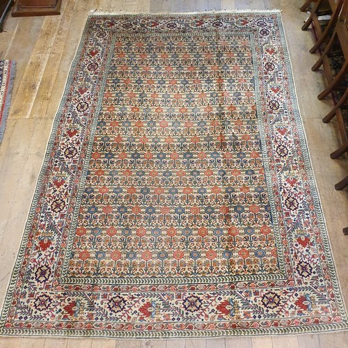 A Persian Tabriz cream ground carpet, 293 x 192 cm