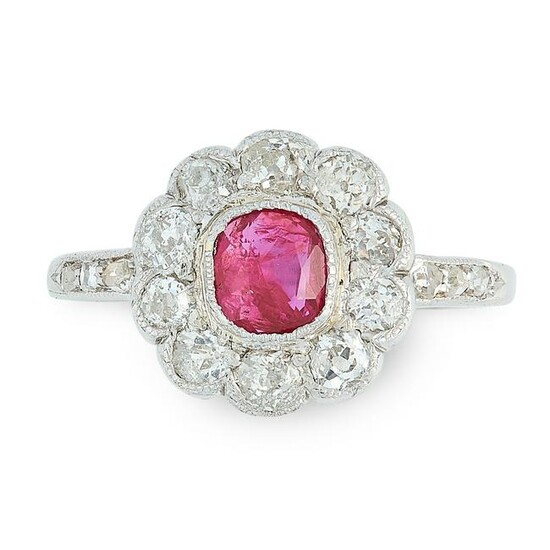 A RUBY AND DIAMOND CLUSTER RING set with a central