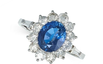 A SAPPHIRE AND DIAMOND CLUSTER RING in 18ct white gold, set with an oval cut sapphire of