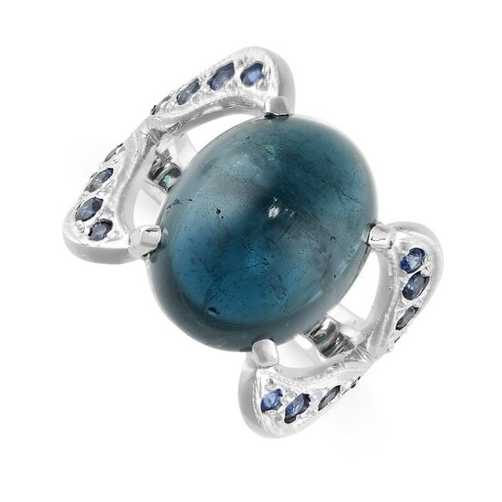 A SAPPHIRE RING set with an oval cabochon blue sapphire