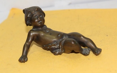 A Signed Solid Bronze Baby Figure