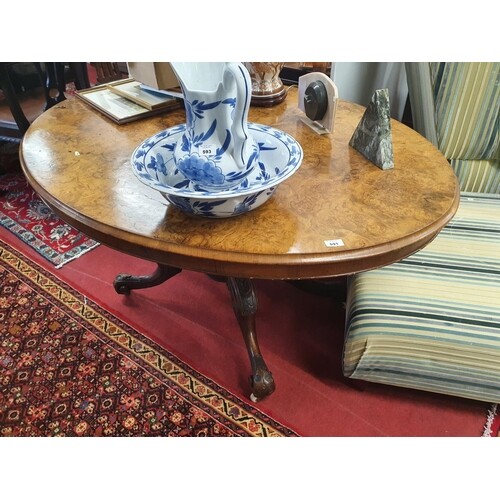 A Victorian Walnut oval Supper Table with a highly veneered ...