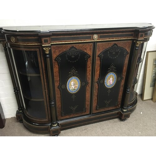 A Victorian gilt metal burr maple credenza the central doors...