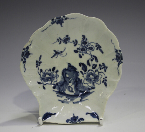 A Worcester porcelain shell shaped pickle dish, circa 1770, painted in blue with the Two Peony Rock