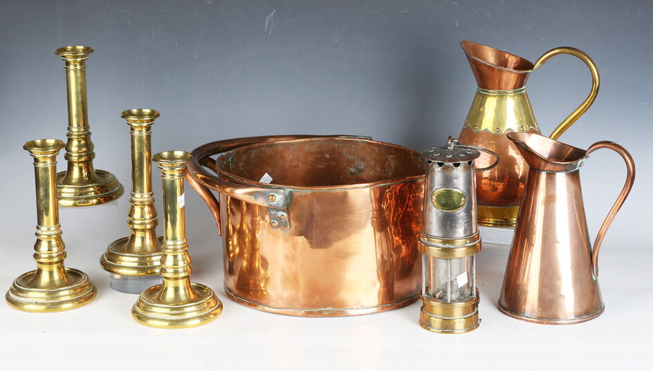 A collection of copper and brassware, including a copper pan, diameter 29cm, a Patterson miner'