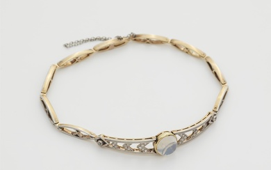 A delicate 14k gold platinum diamond and moonstone bracelet.