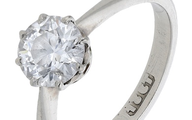 A diamond single stone ring, set with an old brilliant-cut diamond between...