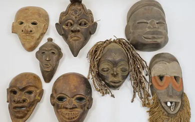 A group of West African and other tribal tourist ware masks, late...