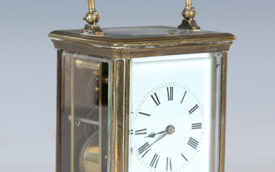A late 19th century brass cased carriage clock with eight day movement striking hours and half hours
