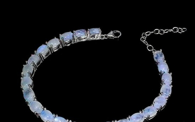 SOLD. A moonstone bracelet set with numerous cabochon moonstones, mounted in rhodium plated sterling silver....