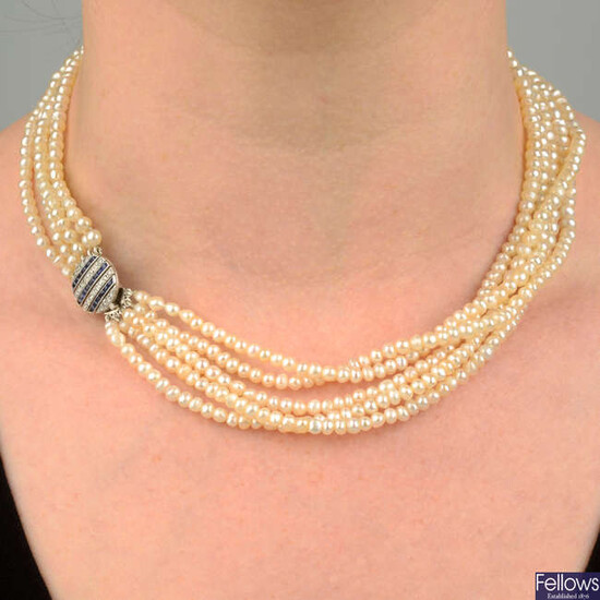 A natural pearl five-strand necklace, with sapphire and diamond clasp.
