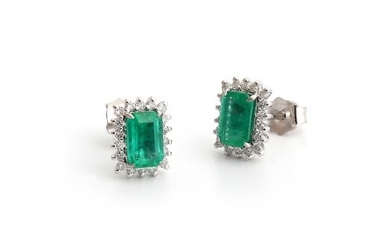 A pair of 18ct white gold (stamped 750) earrings set with emerald cut emeralds and brilliant cut diamonds, L. 1.7cm.