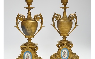 A pair of 19th century French ornamental gilt metal candlest...