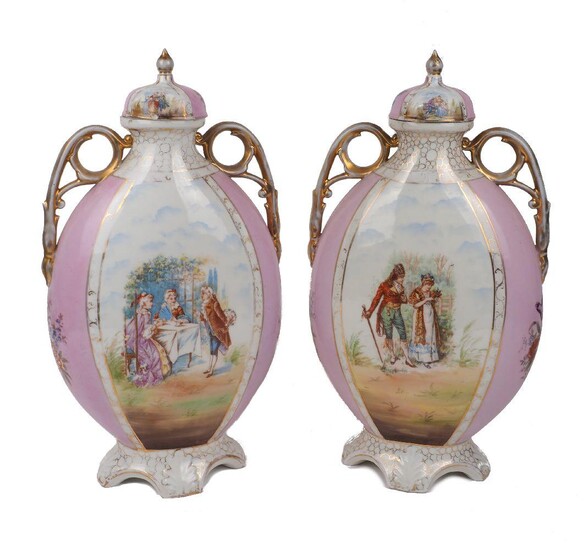 A pair of German ovoid twin handled vases, 20th century, of pink ground decorated in a Dresden style with printed scenes to the body and gilding to the handles, each on a footed base, Sitzendorf style marks to the underside, each vase with a cover...