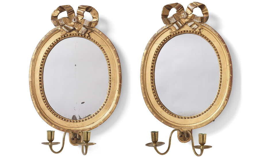 A pair of Gustavian two-light girandole mirrors.