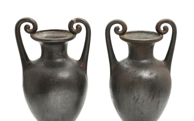 A pair of circa 1900 patinated iron amphora shaped vases. H. 44...