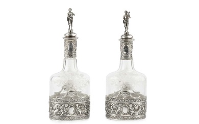 A pair of early 20th century Hanau silver mounted decanters...