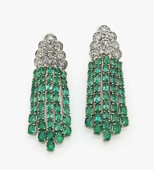 A pair of earrings with brilliant cut diamonds and