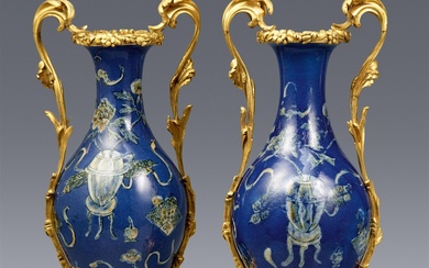 A pair of outstanding Louis XV ormolu-mounted powder-blue Chinese porcelain vases