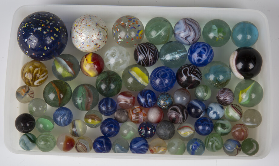 A selection of approximately sixty glass marbles, diameters ranging from 1.4cm to 4.4cm.