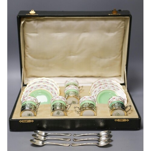 A set of six Aynsley coffee cans and saucers, with silver ho...