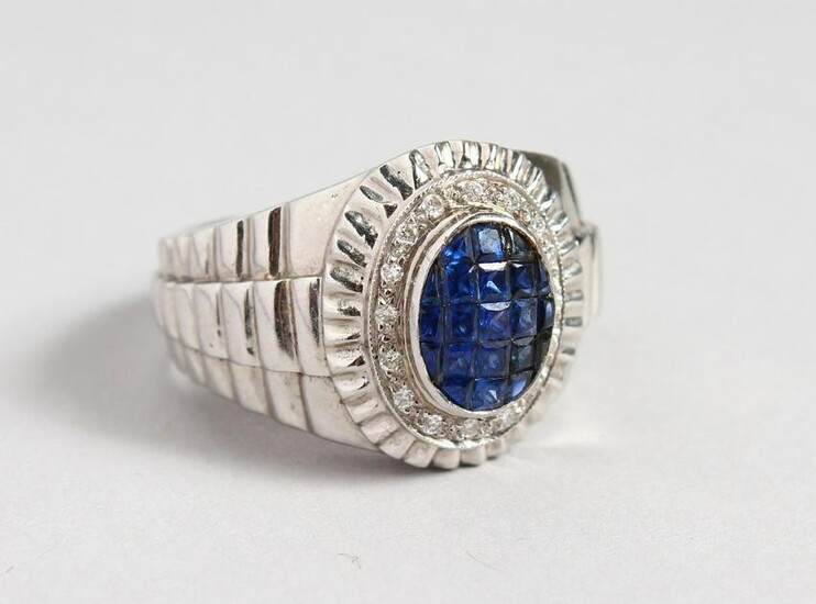 AN 18CT GOLD, DIAMOND AND SAPPHIRE CLUSTER RING.