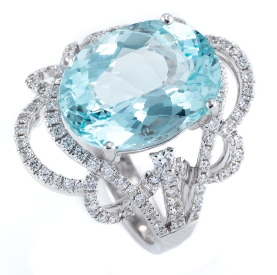 AN 18CT WHITE GOLD AQUAMARINE AND DIAMOND RING; featuring an oval cut aquamarine of approx. 6.63ct to scrolling pierced surround and...