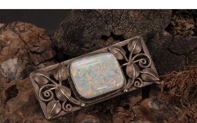 An Art & Crafts silver brooch, rectangular leafy pierced fra...