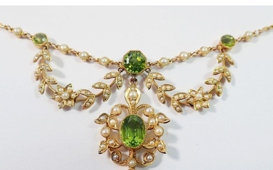 An Edwardian 15ct gold necklace set peridots with seed pearl...