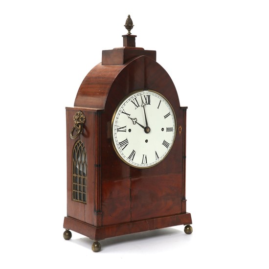An English Regency musical mahogany case table clock in Gothic style. 'Westminster'. Ca. 1830. H. 62 cm. W. 32 cm. D. 17 cm.