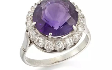 An amethyst and diamond cluster ring, the circular mixed cut...