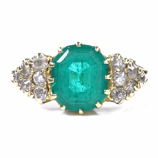An early 20th century unmarked gold solitaire emerald ring, ...