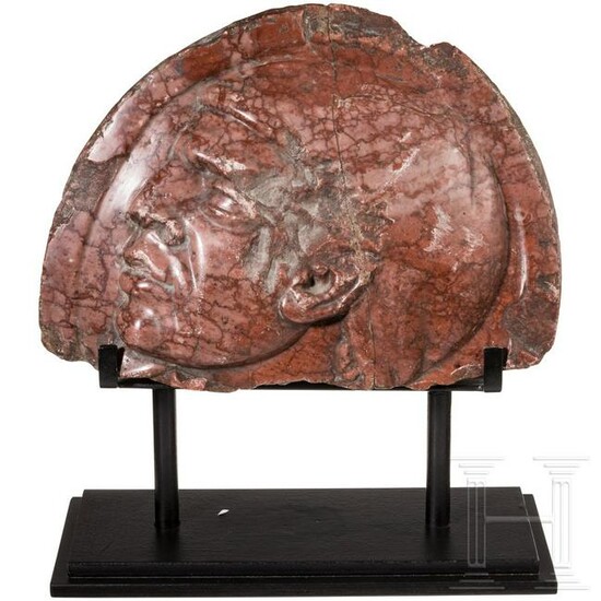 Benito Mussolini - a fragment of a red marble relief