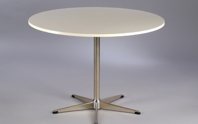 Danish furniture manufacturer. Circular dining table