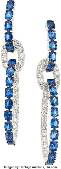 Diamond, Sapphire, White Gold Earrings Stones: Oval-shaped sapphires weighing...