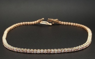 Diamond tennis bracelet with pink diamonds in 14 kt rose gold