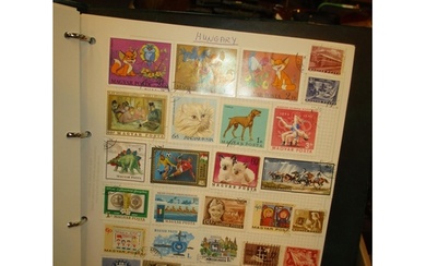 Four Albums with a Good Collection of World Stamps