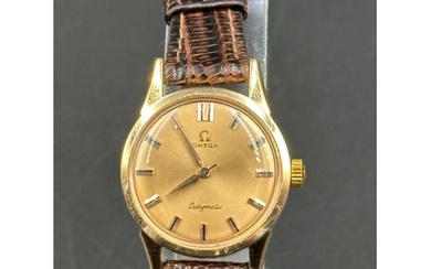 Gold Omega Ladymatic wristwatch on a brown leather strap. 26...
