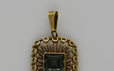 Gold pendant with gemstone