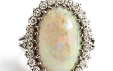 H. Walter-Rasmussen: An opal and diamond ring set with a cabochon opal and brilliant-cut diamonds weighing a total of app. 0.50 ct., mounted in 14k white gold.