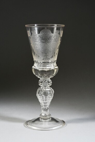 LARGE CRYSTAL COMMEMORATIVE GLASS, WITH THE KINGDOMS OF FRANCE'S ARMS.The baluster leg is decorated with a faceted bulb, supporting a chalice-shaped cup cut at the base of facets, and on the body of a rich engraved decoration of the great arms of...