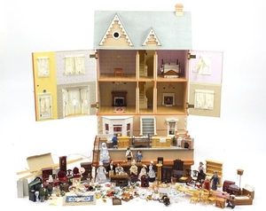 Large wooden dolls house with a large selection of furniture...