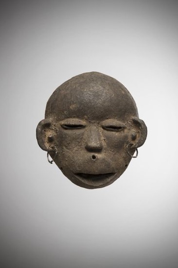 MAKONDE, Tanzania/Mozambique. Rare terracotta mask with half-closed eyes,...