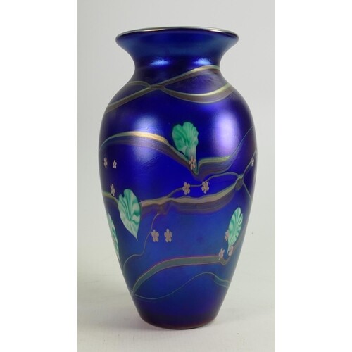 Okra art glass vase: Decorated with iridescent floral design...